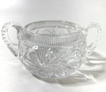 BOÊMIA- BOWL  EM CRISTAL LAPIDADO  EUROPA, SÉC. XIX/X- DUAS ALÇAS EM CRISTAL INCOLOR LAPIDADO À MÃO, COM DECORAÇÃO EM RAIOS E ESTRELAS (CUT GLASS), BORDA SUPERIOR CANELADA. PEÇA DE MESA FINA DO FINAL DO SÉCULO XIX. - ESTILO: VITORIANO TARDIO / EDWARDIANO. - MEDIDAS: 7 X 9 X 15 CM