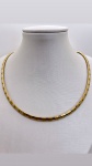 ..GARGANTILHA OMEGA CONFECCIONADO EM OURO AMARELO E OURO BRANCO 18K, PESO: 25,4g. TAMANHO: 40cm. FEC
