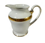 Antiga cremeira em porcelana Barão do Rio Branco (Brasil), rica douração com faixa decorativa folheada e filetada; marcas do tempo. -dim- 12x8x11.