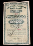 Rara apólice da Prefeitura de Porto Alegre de 1935, valor de 50 mil réis, com cupons de prêmios inclusos, em excelente estado de conservação. Marcas do tempo. -dim- 12x20 