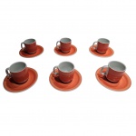 Seis xícaras para café em porcelana Schmidt na cor goiaba sobre fundo branco, Alt. 6  Diam. 5 cm.