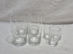 Jogo de 7 copos em cristal lapidado, sendo 4 longos e 3 de aperitivo. Medindo o maior 7cm x 13,5cm de altura; menor 4,5cm x 8cm de altura.