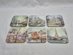 Jogo de 6 descansos de copo em madeira com estampa de paisagens. Medindo 9,5cm x 9,5cm.