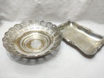Lote de fruteira redonda e travessa retangular em prata 90. Medindo a fruteira 26,5cm x 8cm de altura. Fruteira com desgaste no banho.