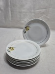Jogo de 6 pratos de sobremesa em porcelana Renner, flor amarela e friso ouro. Medindo 17,5cm de diâmetro.