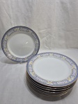 Jogo de 8 pratos rasos de mesa em porcelana Germer com barra azul floral. Medindo 25cm de diâmetro.