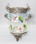 ART NOUVEAU - Circa de 1900 - Vaso em vidro moldado degradê em tom azul e translúcido. Corpo decorado com flores pintadas à mão em policromia realçadas a ouro. Base e guarnição em metal  decorado com elementos florais. Med. 24 x 21 cm. Restauro em um dos pés.