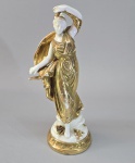 Antiga escultura em porcelana europeia branca e dourado, Séc.XIX, representando Ninfa. Marca  marca azul no fundo. Numerada. Med. 24.5 cm