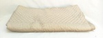 CAMA E MESA, uma (1) colcha para casal em matelassê, tonalidade cinza chumbo, usada, possui furo, pequenos defeitos, vide foto.