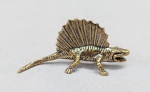 ESCULTURA, uma (1) miniatura animalista, representando DINOSSAURO, confeccionada em bronze maciço, medindo aproximadamente 5 cm comprimento, vide foto.