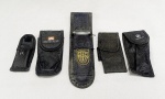 MILITARIA, cinco (5) estojos maleáveis confeccionados em material sintético para fixação no cinto, medindo o maior 23,5 cm comprimento, vide foto.