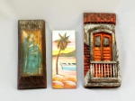DIVERSOS, três (3) itens decorativos, confeccionados em madeira: 1 talha representando fachada de casa, policromada, perdas em uma das laterais, sem assinatura, medindo 28 x 12 cm; 1 pintura sobre madeira, representando marina com barco e coqueiro, medindo 21,5 x 8,5 cm; 1 lito, policromada, representando Santa, aplicada sobre madeira, assinado em cavo no verso LEILA, medindo 25 x 10 cm, vide foto.