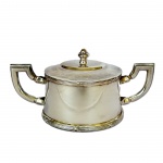 FRACALANZA - Açucareiro em metal espessurado à prata, modelo Croisé, med. 10cm de altura e 20cm de comprimento com alças.