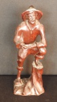 Escultura em madeira entalhada representando " Homem do campo " - pequena perda no chapéu. Alt: 42 cm.