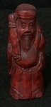 Netsuke de roseira retratando Fu Xing um dos 3 Deuses da China antiga associado a sorte e felicidade  - assinado na base  - Altura 8cm