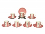 PORCELANAS, sete (7) xícaras para café com seus respectivos pires confeccionadas em porcelana com pintura listrada na tonalidade rosa e elementos florais em policromia, medindo 4,5x6x4cm.