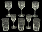 CRISTAIS, lote com oito (8) peças confeccionadas em cristal translucido, sendo: A) 5 taças, sendo 3 para vinho e 2 para licor com lapidação de palmas, caneluras e pingos de diamante em baixo relevo, haste cilíndrica, apoiada sobre base circular, vinho medindo 11x5,5cm e licor 9x4cm e B) 3 copos shots com lapidação de guirlanda floral em baixo relevo, medindo 8x4,5cm.