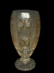 CRISTAL DOUBLE, um (1) vaso confeccionado em CRISTAL DOUBLE na tonalidade amarela, lapidada por flores, folhagens, caneluras e dedões em baixo relevo, haste facetada apoiada sobre base circular com fundo estrelado, apresentando bicados na borda e na base, medindo 31x12cm.