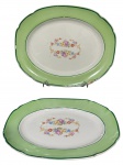 FAIANÇA SÃO CAETANO, duas (2) travessas ovais confeccionadas em faiança vitrificada na tonalidade branca com espessa faixa na borda na tonalidade verde com filete na tonalidade escura. Maior medindo 31x25cm (bicada na borda) e menor 27x20cm, falhas na pintura.