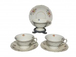 KPM Krister Porzellan-Manufaktur (Fundada em 1831 por Carl Franz Krister), três (3) xícaras para chá com seus respectivos pires (sendo 2 adaptados na tonalidade creme, porém, da mesma marca) confeccionadas em porcelana na tonalidade branca, elementos vegetalistas em relevo na pasta, pintura de flores e folhagens em policromia e borda filetada em ouro, medindo 6x11,5x10cm.
