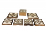 DIVERSOS, lote com sete (7) peças, sendo: 1 caixa porta joias e 6 descansos para pirex, estruturas confeccionadas em madeira, incrustado por azulejos com pintura floral em monocromia, caixa medindo 7x13x13cm, maior descanso 17,5x17,54cm e menor 13x13cm.
