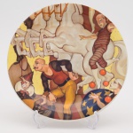 Prato em porcelana Oxford comemorativo à inauguração do Centreventos Cau Hansen (São Bento do Sul -  SC em 1998). Decoração do prato remetendo à obra "O Circo" de JUAREZ MACHADO, que ornamenta o pórtico do Centreventos. Diâmetro: 26 cm.