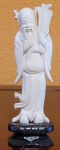 Escultura em marfim (China, século XIX) representando  SHOU LAO deus da longevidade. Med.: 10cm.