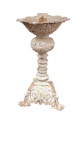 Castiçal em estilo rococó, com base tripé ricamente ornada por volutas e elementos vazados, haste torneada e copa superior em formato floral. Apresenta acabamento em pátina branca com realces dourados. Apresenta desgastes compatíveis com o tempo e pequenas perdas na borda superior. , altura 28 cm  ( NO ESTADO )