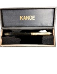 Estilosa caneta esferográfica da marca Kanoe, preta com dourado ,funcionando  