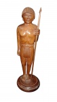 Escultura em madeira representando índio , sobre base de madeira ,altura  27 cm
