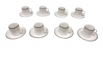 Conjunto de oito xícaras para café com seus respectivos pires em porcelana Germer borda  filetada na cor preta. Década de 70.