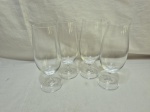 Jogo de 4 taças de cerveja em vidro incolor. Medindo 5,5cm de boca x 19cm de altura.