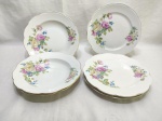 Jogo de 7 pratos em porcelana polonesa KPM floral com friso ouro, sendo 3 fundos e 4 rasos. Medindo sopa 24cm de diâmetro, mesa 24,5cm de diâmetro.