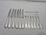 Jogo de 12 talheres de sobremesa em prata 90 Fracalanza, sendo 6 de cada. Medindo a faca 22cm de comprimento, garfo 16,5cm de comprimento.