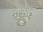 Jogo de 6 copos de aperitio em cristal incolor com base moldado. Medindo 6cm x 8cm de altura.