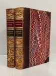 DICKENS Charles. - THE LIFE AND ADVENTURES OF NICHOLAS NICKLEBY. London: Ghapman and Hall, 1879. 2 volumes.435 pp. 430 pp. Encadernação antiga com lombo e cantos marrom e douração. Páginas íntegras e limpas com os três cortes marmorizados. 13 x 20 cm.