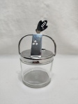 Linda meleira em vidro com tampa e alça em aço inox WMF. Medindo 9cm x 8,5cm de altura sem alça.