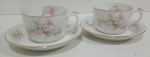 LIMOGES - PAR DE XÍCARAS EM PORCELANA FRANCESA COM DECORAÇÃO FLORAL. PEÇA MARCADA NA BASE. MEDINDO A XÍCARA 5.5 X 8 X 11 CM E O PIRES 14 CM