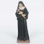 ARTE SACRA, uma (1) imaginária representando Santa Rita de Cássia, confeccionada em resina policromada, medindo 23,5 cm altura, vide foto.