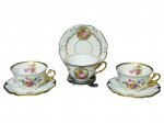 PORCELANA MAUÁ, três (3) xícaras para chá com seus respectivos pires confeccionados em porcelana nacional, sendo: A) 2 decoradas por flores e folhagens em policromia, filetes e frisos em ouro, medindo 5x11x9cm e B) 1 decorada por cena galante em policromia com filetes e elementos vegetalistas em ouro, medindo 5,5x11x9cm.