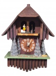 RELÓGIO, um (1) relógio de parede confeccionado em madeira, com caixa em formato de casa alpina, mostrador circular com numerais romanos, figuras ornamentais na parte superior, termômetro central e aplicação de árvores laterais em relevo, apresenta quebras, movimento a pilha, ausência da tampa traseira, não possui pêndulo, no estado, medindo 33x26x14cm.