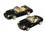 COLECIONISMO, duas (2) miniaturas de automóveis conversíveis, em metal e material sintético, sendo uma (1) Porsche 911 Series, da marca NT Models, escala 1/18, e uma (1) BMW Z8 1999, da marca SS, escala 1/24, ambas em coloração preta, com interiores claros, maior medindo 23,5x9,5cm e menor 18x7,5cm. Porshe possui sinal de cola.