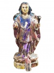 ARTE SACRA, Bahia, séc. XIX, uma (1) imaginária confeccionada em madeira entalhada a mão representando Santa Bárbara, olhos em vidro, apresenta sinais de cupim tratado, patina com esmaltagem abóbora, braço quebrado, segura lírio em metal dourado, vendida no estado da foto, medindo 23cm de altura.