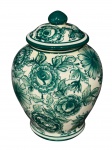 LUIZ SALVADOR, um (1) potiche confeccionado em faiança vitrificada na tonalidade branca com pintura floral em monocromia na tonalidade verde, apresenta imperceptível bicado na tampa, medindo 20x8,5cm.