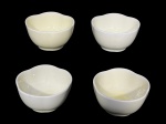 NORITAKE e VARIG, quatro (4) recipientes para sobremesa confeccionados em porcelana na tonalidade verde com bordas em ondulações, medindo 4,5x8,5cm.