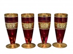 VIDROS, quatro (4) pequenas tulipas confeccionadas em vidro pintado na tonalidade vinho, espessa faixa e realces em ouro com decoração de arabescos e elementos geométricos na cor branca, medindo 11x4,5cm, falhas na douração.