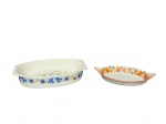 PORCELANAS, duas (2) peças confeccionadas em porcelana branca, sendo: A) REAL, 1 pirex oval, refratário, decorado por elementos florais em policromia, medindo 6x28,5x17,5cm e B) ARS BOHEMIA, 1 travessa oval decorado por guirlanda de pássaros e elementos florais em policromia com borda filetada na tonalidade abóbora, medindo 4x23,5x14cm.