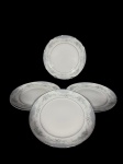 PORCELANA / SCHMIDT - (6) Pratos para sobremesa confeccionados em porcelana nacional na tonalidade branca , decorado por guirlandas de flores , pássaros e elementos vegetalistas em policromia , filetados à prata , medida : 19 cm, sem uso
