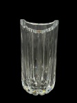 CRISTAL EUROPEU, um (1) vaso cilíndrico confeccionado em grosso cristal translucido com lapidação de caneluras em baixo relevo e borda recortada, bicado na borda, medindo 23x11cm.