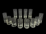 CRISTAL HERING, lote com doze (12) copos confeccionados em cristal translucido com lapidação de esferas em baixo relevo, sendo: A) 6 long drinks, medindo 14,5x5,5cm e B) 6 copos para água, medindo 11x6,5cm.